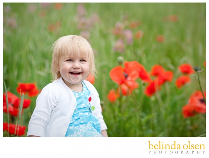 young toddler girl in a field of flowers
